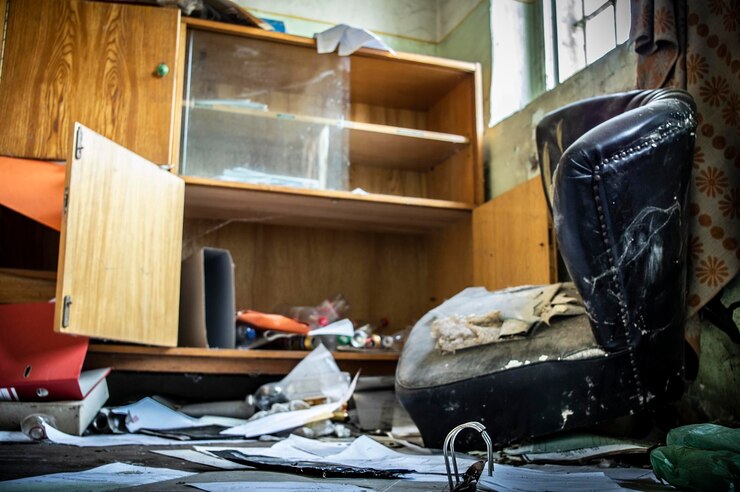 Before image showing an extremely cluttered and messy kitchen
